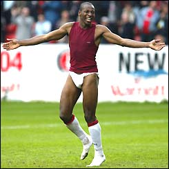 Luis Boa Morte parades around the pitch wearing few clothes after giving his kit to Fulham fans