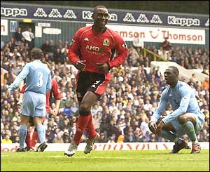 Andy Cole turns to celebrate Blackburn's fourth goal