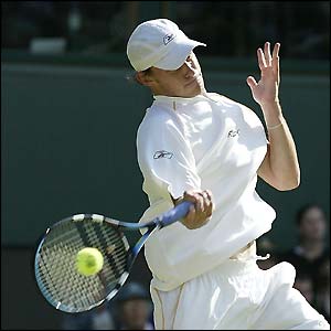 Andy Roddick gets a racquet onto one of Greg Rusedski's serves