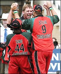 Tatenda Taibu, Ray Price and Heath Streak celebrate Price's dismissal of Robert Key
