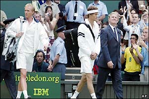 British actor Paul Bettany (left) is the fictional hero as the filming of 'Wimbledon' delays the start of Henman's match against Llodra