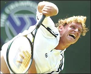 Argentine David Nalbandian serves in his second-round match against Andre Sa