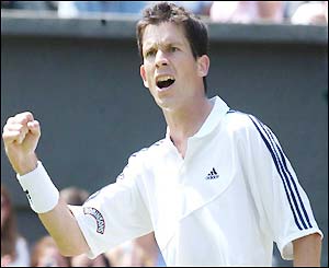 Henman celebrates taking the first set 6-4