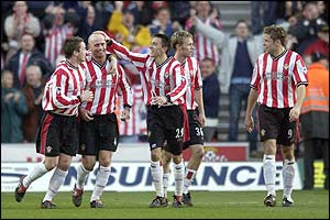 Southampton's Chris Marsden is surrounded by delighted team-mates after his goal against Wolves