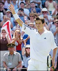 Henman salutes his adoring fans on Centre Court after claiming victory