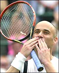 Andre Agassi salutes the crowd after his win