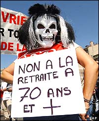 Demonstrator with placard saying: 'No to retirement at 70-plus'