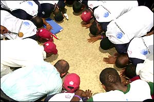 West Indies team on their knees 
