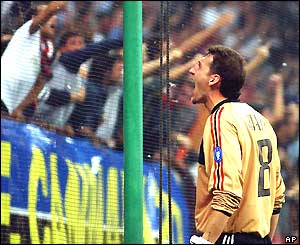 Christian Abbiati shouts with delight at the AC Milan fans after his side take the lead