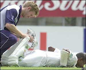 Sanath Jayasuriya is recieves treatment after he is hit by the ball