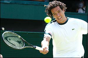 Younes El Aynaoui returns to Andre Agassi during their third round match 