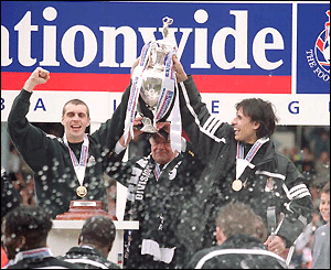 Chris Coleman holds aloft the First Division championship trophy at Fulham 