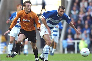 Glenn Little of Reading is chased by Lee Naylor