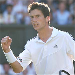 Tim Henman celebrates breaking his opponents' serve in the first set