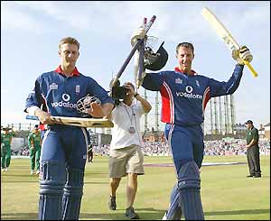 Marcus Trescothick and Jim Troughton celebrate victory as they leave the field
