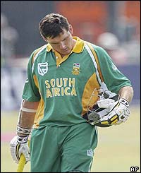 South Africa's captain Graeme Smith leave the pitch after being dismissed for seven by Zimbabwe's Douglas Hondo