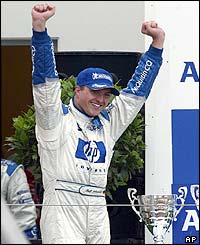 Ralf Schumacher celebrates his win