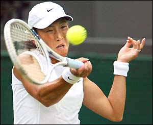 Ai Sugiyama contorts her face as she hits a forehand