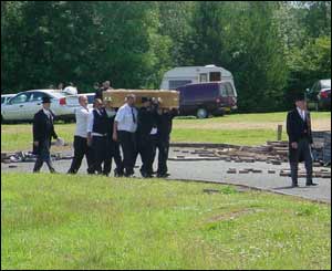 The bearers carrying Mr Smith's coffin