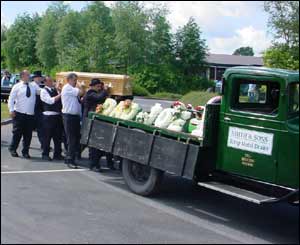 His coffin was taken to church on the back of a vintage truck