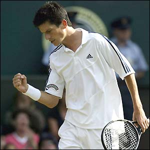 Tim Henman shows his delight at breaking David Nalbandian's serve