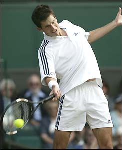 Tim Henman hits a forehand