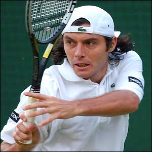 Sebastien Grosjean hits a backhand