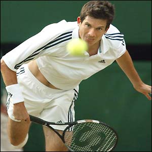 Tim Henman serves