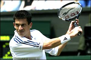 Tim Henman in action during the 2002 semi-final against Lleyton Hewitt