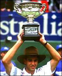 Pete Sampras poses with the Australian Open trophy 