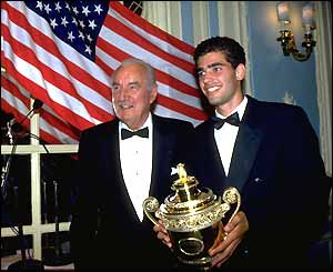 Pete Sampras poses with tennis legend Fred Perry and the US Open trophy in 1993