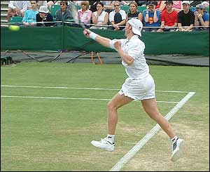 Rainer Schuettler in the air as he returns the ball to Todd Martin