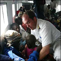 People are secured on board a plane evacuating them from Bunia 