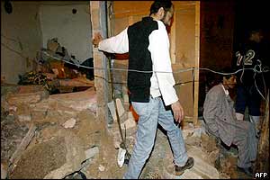 The owner of a house in Casablanca's old city, surveys the damage to his home after a suicide bomb 