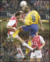 Arsenal defender Martin Keown in an aerial challenge with Saints striker James Beattie