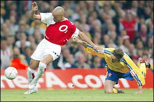 Arsenal striker Thierry Henry has a shot on goal after only 20 seconds