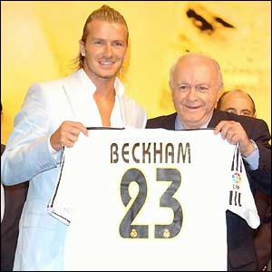 David Beckham is presented with his Real Madrid shirt by club legend Alfredo di Stefano 