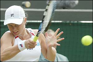 Clijsters wins 12 of the last 13 games to take the match 5-7 6-0 6-1 