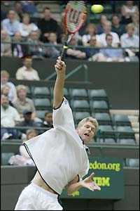 Alexander Popp serves during his opening service game