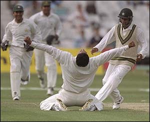 Wasim Akram celebrates his 300th Test wicket at the Oval against England in 1996
