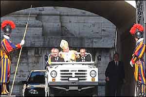 Pope John Paul II arrives on his popemobile 