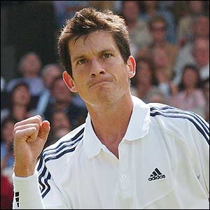 Henman pumps his fist after breaking the serve of Grosjean