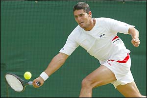 Mark Philippoussis stretches for a forehand return
