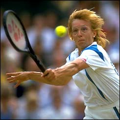 Martina Navratilova stretches for the ball with her hair flailing