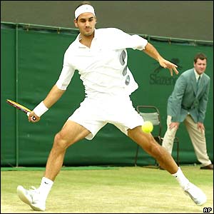 Roger Federer plays a forehand