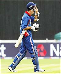 Michael Vaughan looks dejected as he leaves the field