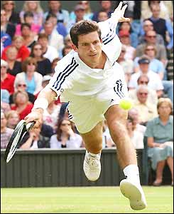 Tim Henman stretches for a volley