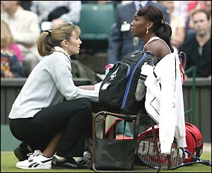 Venus Williams receives treatment for an injury