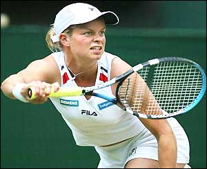 Kim Clijsters looks determined as she plays a forehand