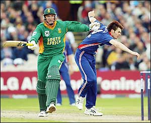 James Anderson is pushed out of the way by Graeme Smith as he completes a run